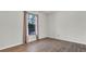 Bright bedroom with natural light streaming through the window and new floors at 8050 Eacon Ct, Hudson, FL 34667