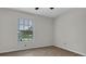 Bright bedroom with natural light streaming through the window and new floors at 8050 Eacon Ct, Hudson, FL 34667