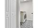 Laundry room featuring a washer and dryer with tiled floors at 8050 Eacon Ct, Hudson, FL 34667