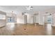 Open living room features wood-look floors, neutral walls, and modern light fixtures at 8050 Eacon Ct, Hudson, FL 34667