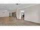 Open living room with lots of light, wood floors, and a modern ceiling fan at 8050 Eacon Ct, Hudson, FL 34667