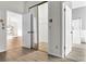 Spacious walk-in closet located off of the primary bedroom with wood floors at 8050 Eacon Ct, Hudson, FL 34667