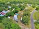 Overhead shot showing the home's location with above ground pool on a large lot surrounded by trees and other houses at 12410 Myrtlewood Dr, Riverview, FL 33579