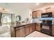Stylish kitchen featuring modern appliances and granite countertops at 32668 Abby Lax Ln, Wesley Chapel, FL 33543