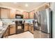 Updated kitchen featuring stainless steel appliances and plenty of cabinet space at 32668 Abby Lax Ln, Wesley Chapel, FL 33543