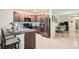 Modern kitchen with stainless steel appliances and granite countertops at 32668 Abby Lax Ln, Wesley Chapel, FL 33543