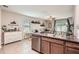 Open-concept kitchen overlooking the living area at 32668 Abby Lax Ln, Wesley Chapel, FL 33543