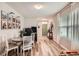 Inviting living area with wood floors and a bright green front door at 32668 Abby Lax Ln, Wesley Chapel, FL 33543