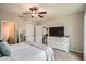 Bedroom featuring a ceiling fan, closet, and a TV on a white dresser at 32668 Abby Lax Ln, Wesley Chapel, FL 33543