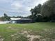 Lush backyard featuring screened-in pool area offers great outdoor space and privacy at 37341 Rutledge Dr, Zephyrhills, FL 33541