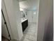 Bathroom featuring a double sink vanity with modern fixtures and plank tile flooring at 37341 Rutledge Dr, Zephyrhills, FL 33541