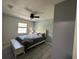 Well lit, stylish bedroom with a ceiling fan and calming color scheme at 37341 Rutledge Dr, Zephyrhills, FL 33541