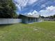 Charming home with a well-manicured lawn and a modern white fence enhancing curb appeal at 37341 Rutledge Dr, Zephyrhills, FL 33541