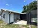 Charming home exterior features a cozy patio area and easy access to the spacious backyard at 37341 Rutledge Dr, Zephyrhills, FL 33541