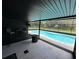 Relaxing pool area features comfortable seating and views of the pool and landscaped backyard at 37341 Rutledge Dr, Zephyrhills, FL 33541