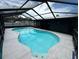 Sparkling pool inside screened enclosure offers a refreshing retreat and a relaxing outdoor living space at 37341 Rutledge Dr, Zephyrhills, FL 33541