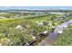 A serene aerial view of a waterfront community with boat docks and lush landscaping at 9934 Peninsular Dr, Gibsonton, FL 33534