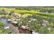 Aerial view of homes with docks, lush trees, and river access at 9934 Peninsular Dr, Gibsonton, FL 33534