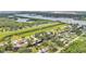 Scenic aerial view of a waterfront neighborhood featuring canal access and lush greenery at 9934 Peninsular Dr, Gibsonton, FL 33534
