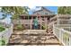 Charming home with a spacious backyard, complete with a screened-in porch and multiple decks at 9934 Peninsular Dr, Gibsonton, FL 33534