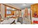 Full bathroom with a sink, mirror, toilet and washer and dryer plus a bathtub with shower curtain at 9934 Peninsular Dr, Gibsonton, FL 33534