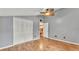 Bright bedroom with hardwood floors, ceiling fan, and closet at 9934 Peninsular Dr, Gibsonton, FL 33534