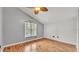 Cozy bedroom boasts hardwood floors, ample natural light from a large window, and a relaxing ambiance at 9934 Peninsular Dr, Gibsonton, FL 33534