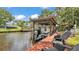 Waterfront property with a private boat dock and lift, ideal for boating enthusiasts at 9934 Peninsular Dr, Gibsonton, FL 33534
