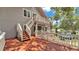 Charming home with a stairway to a second story porch overlooking a lush, green backyard at 9934 Peninsular Dr, Gibsonton, FL 33534