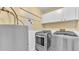 Well-equipped laundry room with modern washer and dryer, offering convenience and functionality at 9934 Peninsular Dr, Gibsonton, FL 33534