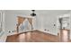 Bright living room boasts hardwood floors and access to a screened-in porch through elegant glass doors at 9934 Peninsular Dr, Gibsonton, FL 33534