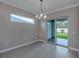 Dining room with sliding glass doors and a view of the backyard at 1760 Lugano Cir, Nokomis, FL 34275