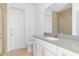 Modern bathroom with gray countertops, white cabinets, and a glass shower at 3157 Bay City Ter, North Port, FL 34286