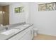 Bathroom featuring double sinks and a large mirror at 3157 Bay City Ter, North Port, FL 34286