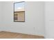 Bright, airy bedroom with wood floors and a large window at 3157 Bay City Ter, North Port, FL 34286