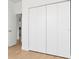Bright closet featuring white folding doors and hardwood floors at 3157 Bay City Ter, North Port, FL 34286