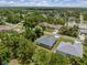 Aerial view of a house and surrounding neighborhood, showcasing the property's location and setting at 3157 Bay City Ter, North Port, FL 34286