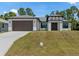 Newly built home with a two-car garage and modern facade at 3157 Bay City Ter, North Port, FL 34286