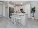 Modern kitchen with a large island and stainless steel appliances at 934 E Venice Ave, Venice, FL 34285