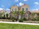 Two-story house with stone accents and landscaping at 934 E Venice Ave, Venice, FL 34285