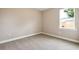Well-lit bedroom featuring neutral walls and carpet flooring at 1508 Atwater Dr, North Port, FL 34288