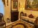 Sitting area features elegant furniture and electric fireplace at 12209 Cotorro Ave, North Port, FL 34287
