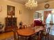 Elegant formal dining room with a view into the living room at 12209 Cotorro Ave, North Port, FL 34287