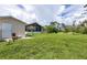 Spacious backyard with shed and screened enclosure at 12209 Cotorro Ave, North Port, FL 34287