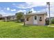 Large backyard with shed and grassy area at 12209 Cotorro Ave, North Port, FL 34287