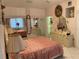Main bedroom with large bed, mirrored closets, and elegant decor at 12209 Cotorro Ave, North Port, FL 34287