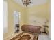 Small bedroom with a twin bed and access to exterior at 12209 Cotorro Ave, North Port, FL 34287