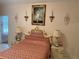 Elegant bedroom with ornate bed, nightstands, and wall art at 12209 Cotorro Ave, North Port, FL 34287