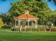 Relaxing gazebo with benches, surrounded by lush landscaping at 117 Clifton Way, Venice, FL 34292