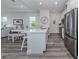 Modern kitchen with stainless steel appliances and breakfast bar at 117 Clifton Way, Venice, FL 34292